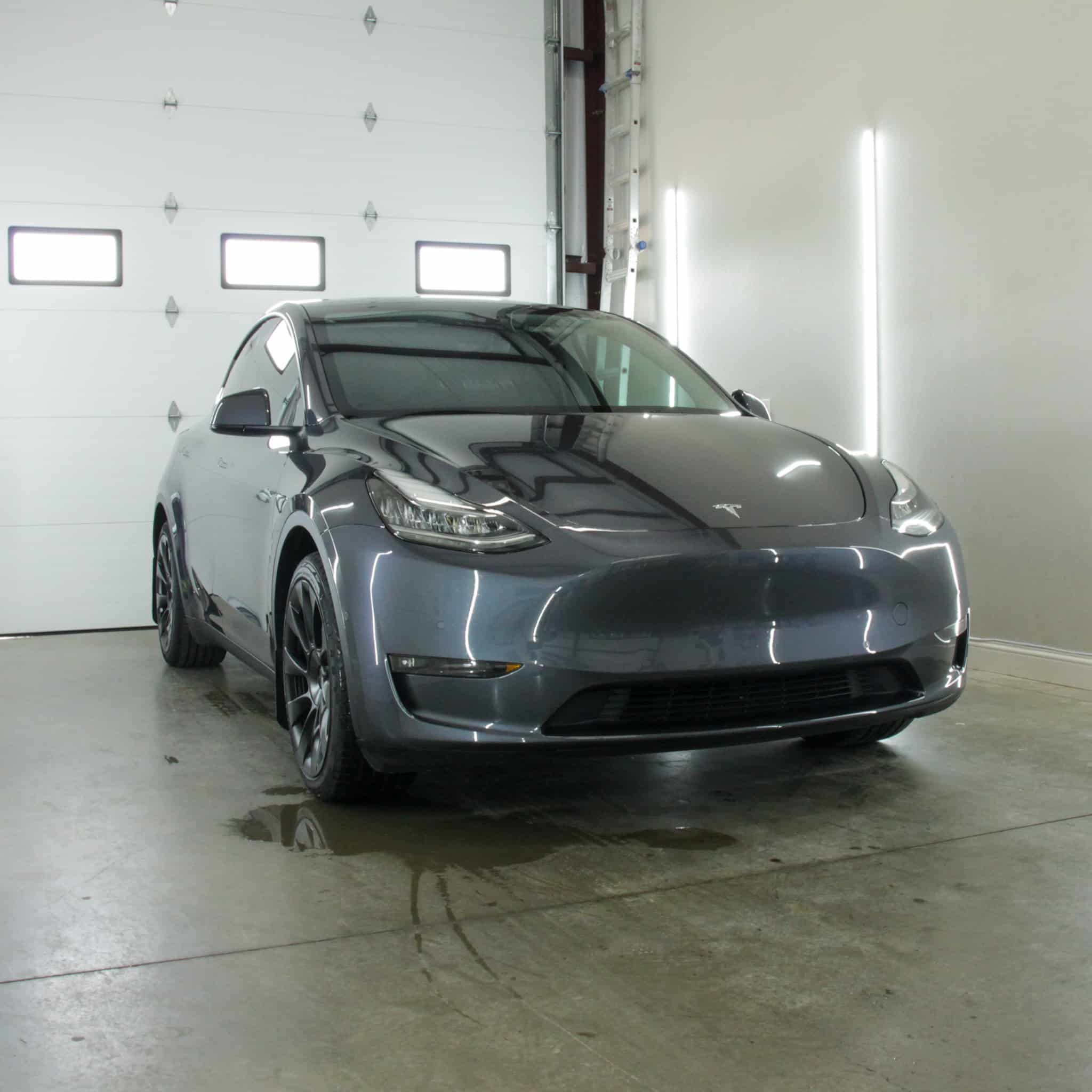 High-end Tesla Model Y exterior detailing with ceramic coating and PPF by Envy This Detailing in College Station, TX—premium paint protection and gloss enhancement.