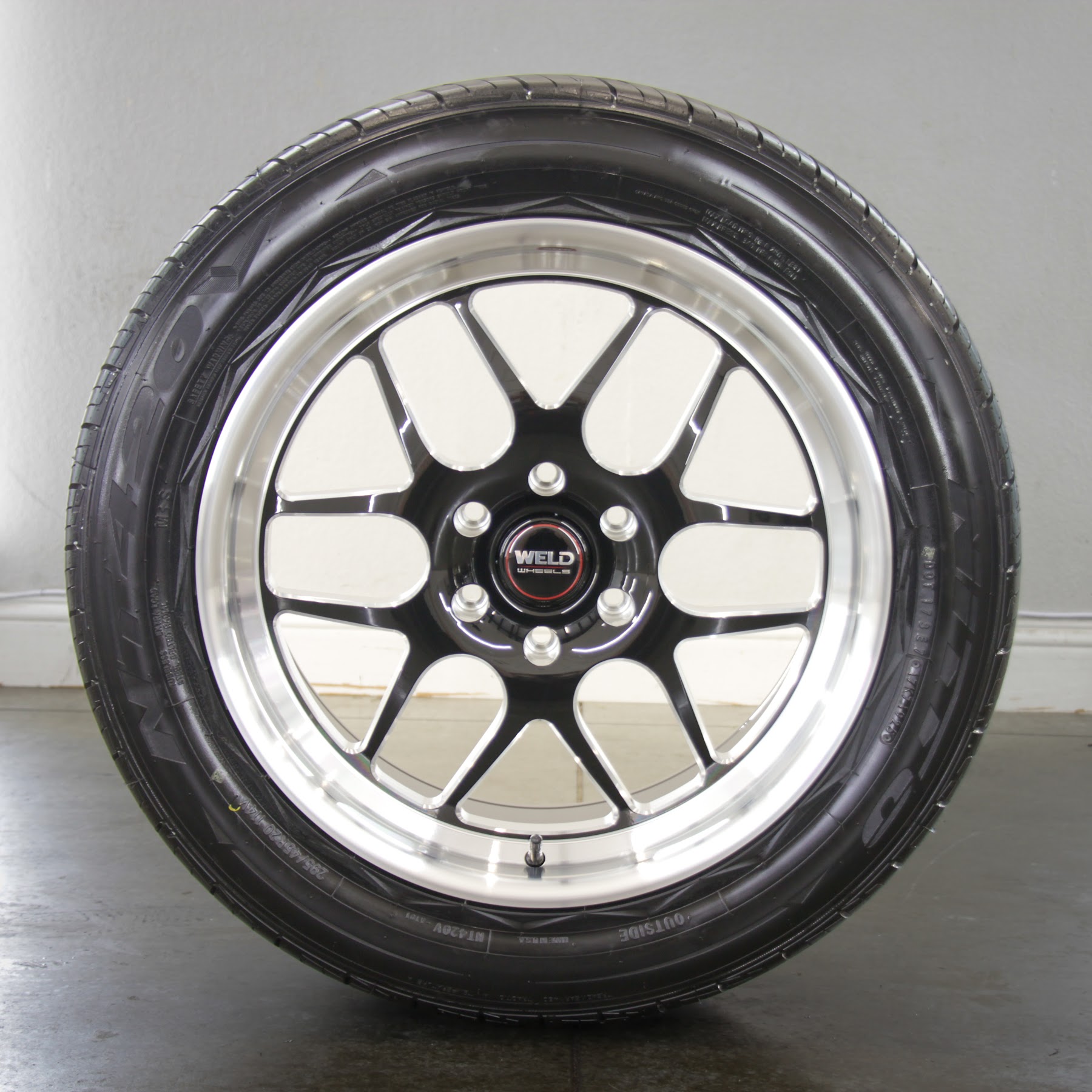 Clean, detailed wheel and tire in the Envy This Detailing shop, College Station, TX
